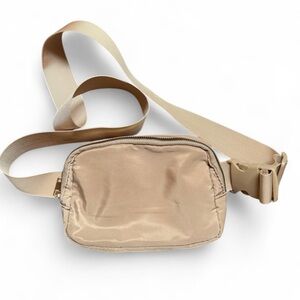 LIGHT TAN belt bag/crossbody. Black interior. Like NEW!